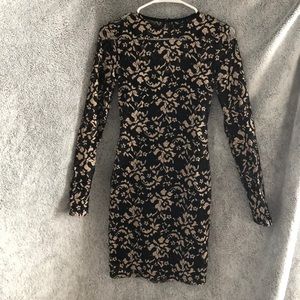 Long sleeved lace bodycon dress.